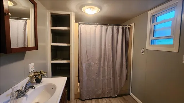a bathroom with a sink and a mirror