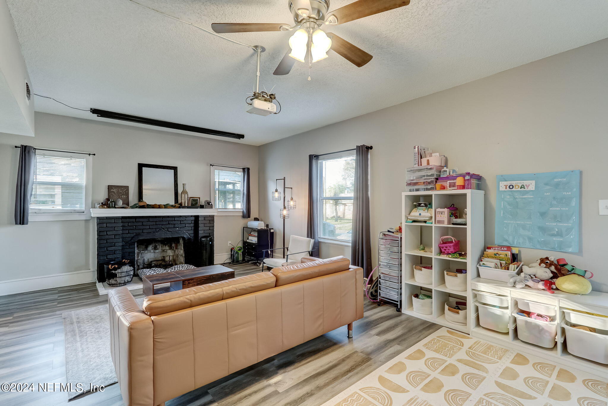 5316 Colonial Avenue Jacksonville, FL 32210 - Photo 11 of 30 a living room with furniture and a wooden floor