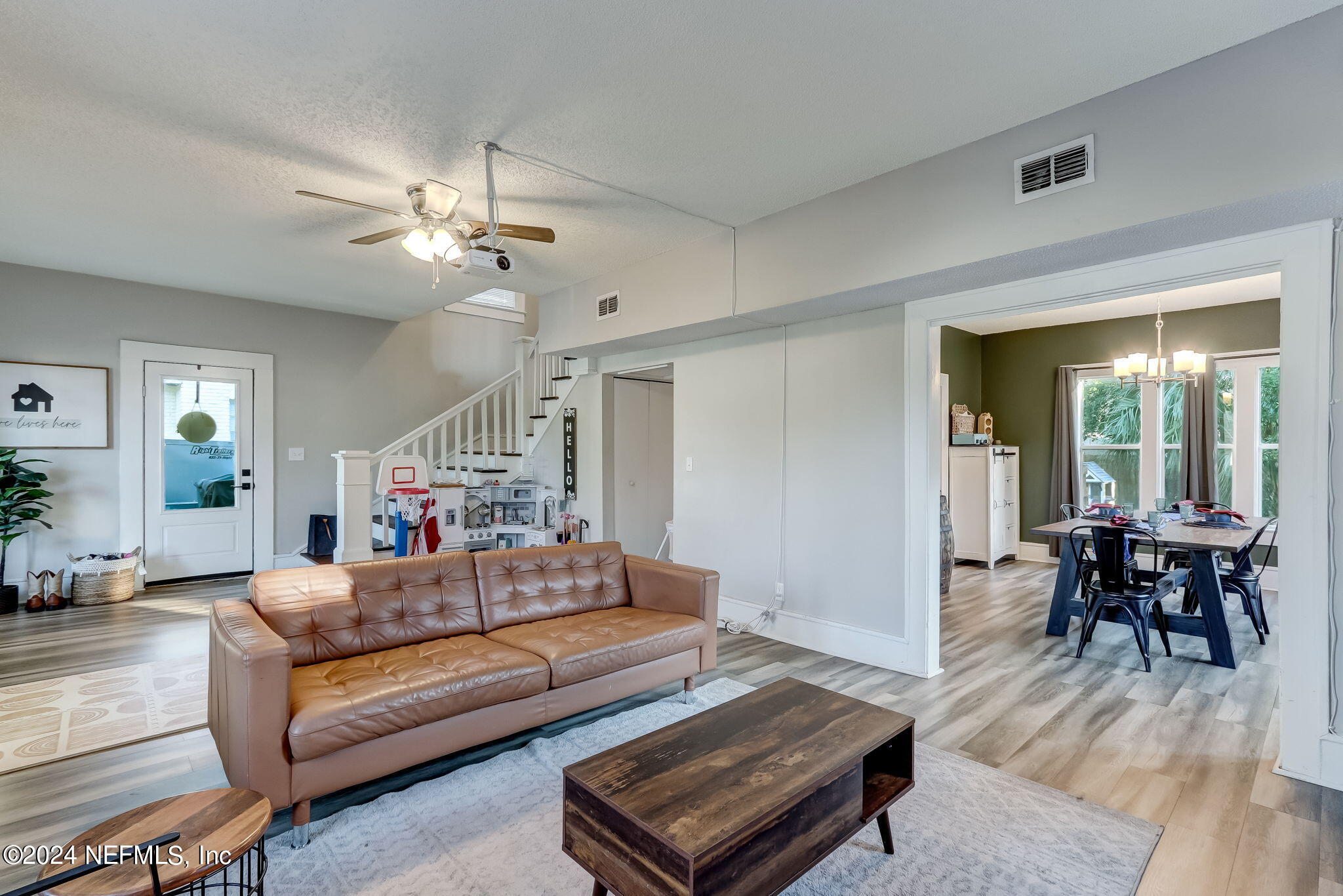 5316 Colonial Avenue Jacksonville, FL 32210 - Photo 12 of 30 a living room with furniture a table and wooden floor