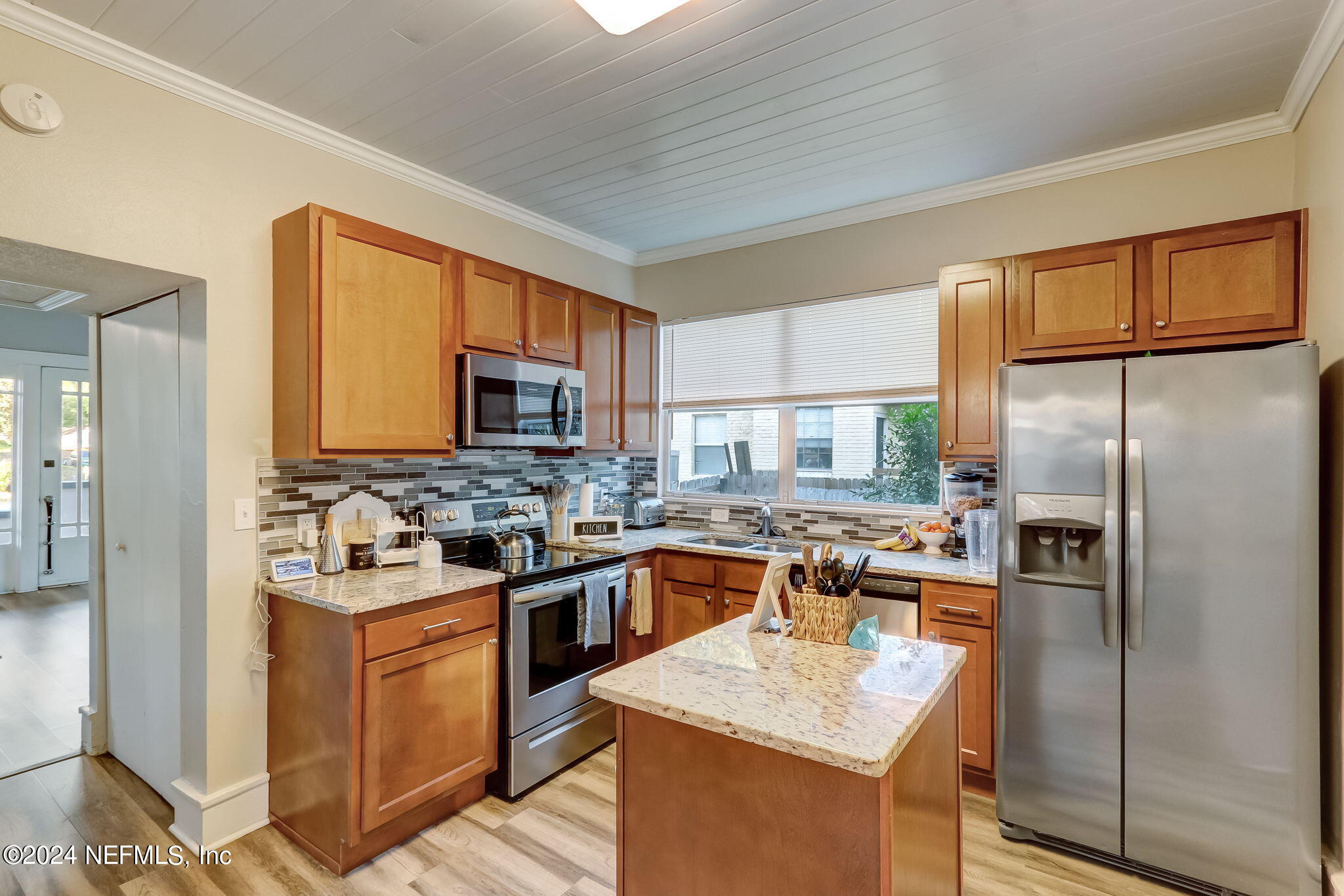 5316 Colonial Avenue Jacksonville, FL 32210 - Photo 13 of 30 a kitchen with a stove sink and refrigerator