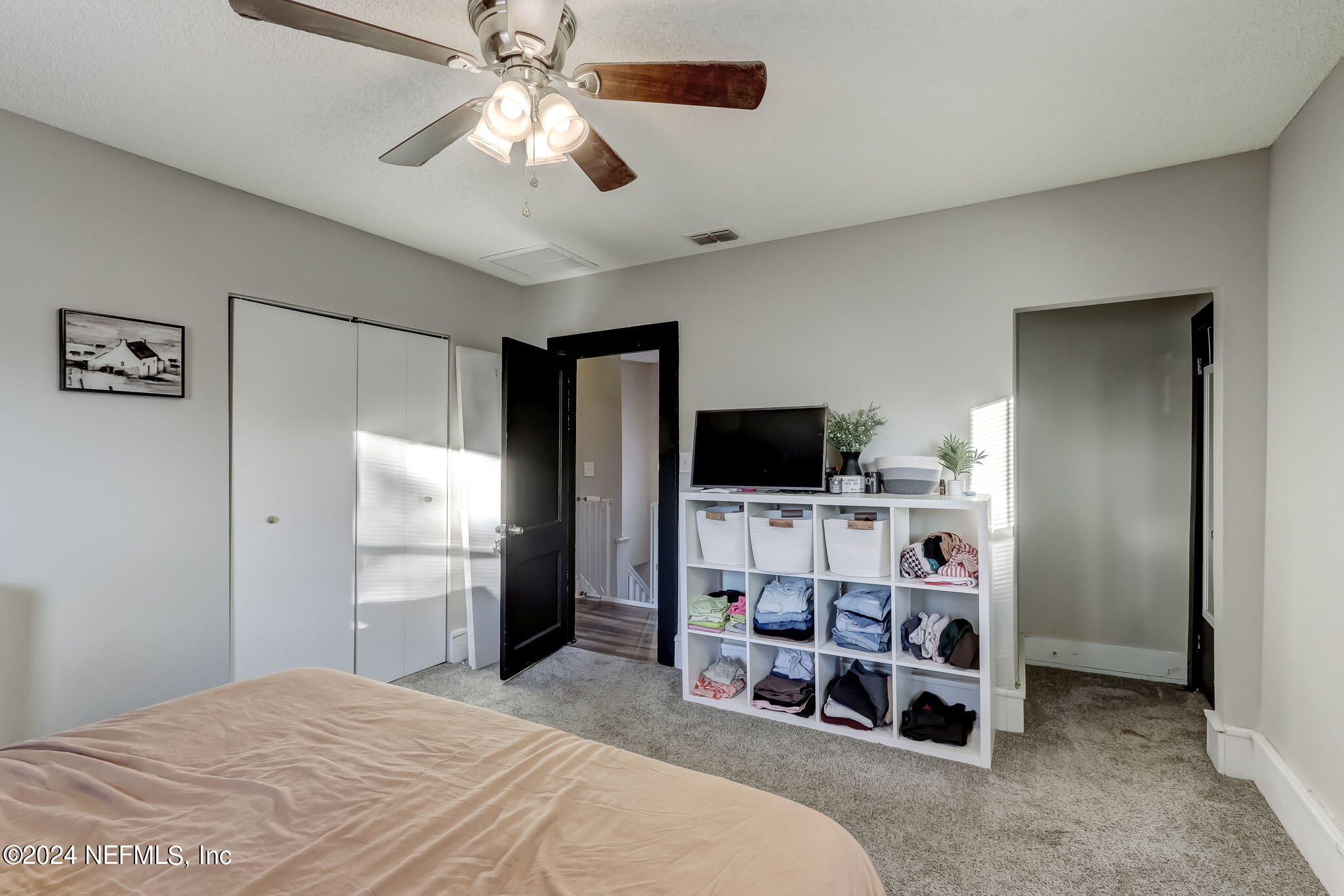 5316 Colonial Avenue Jacksonville, FL 32210 - Photo 21 of 30 a bedroom with a bed and a flat screen tv