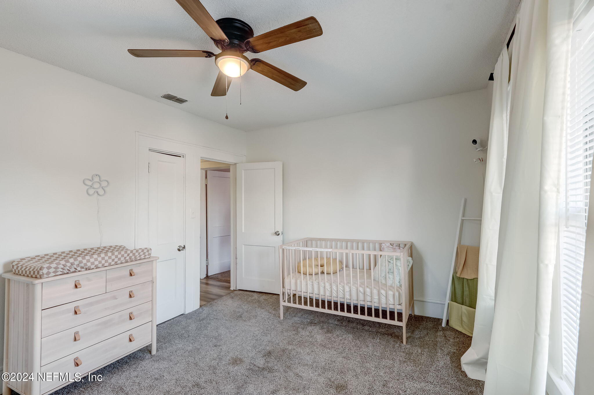 5316 Colonial Avenue Jacksonville, FL 32210 - Photo 22 of 30 a view of a bedroom with furniture window and ceiling fan