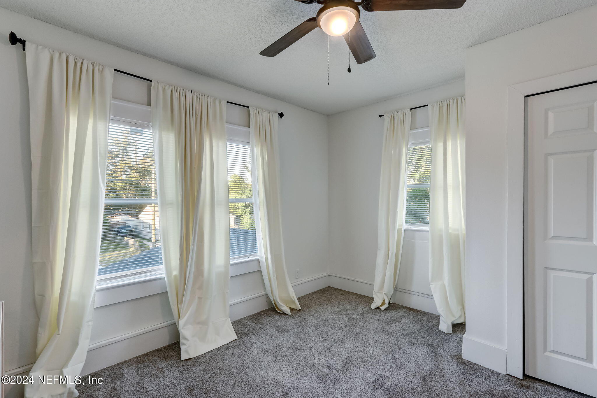 5316 Colonial Avenue Jacksonville, FL 32210 - Photo 23 of 30 a view of a livingroom with a ceiling fan and window