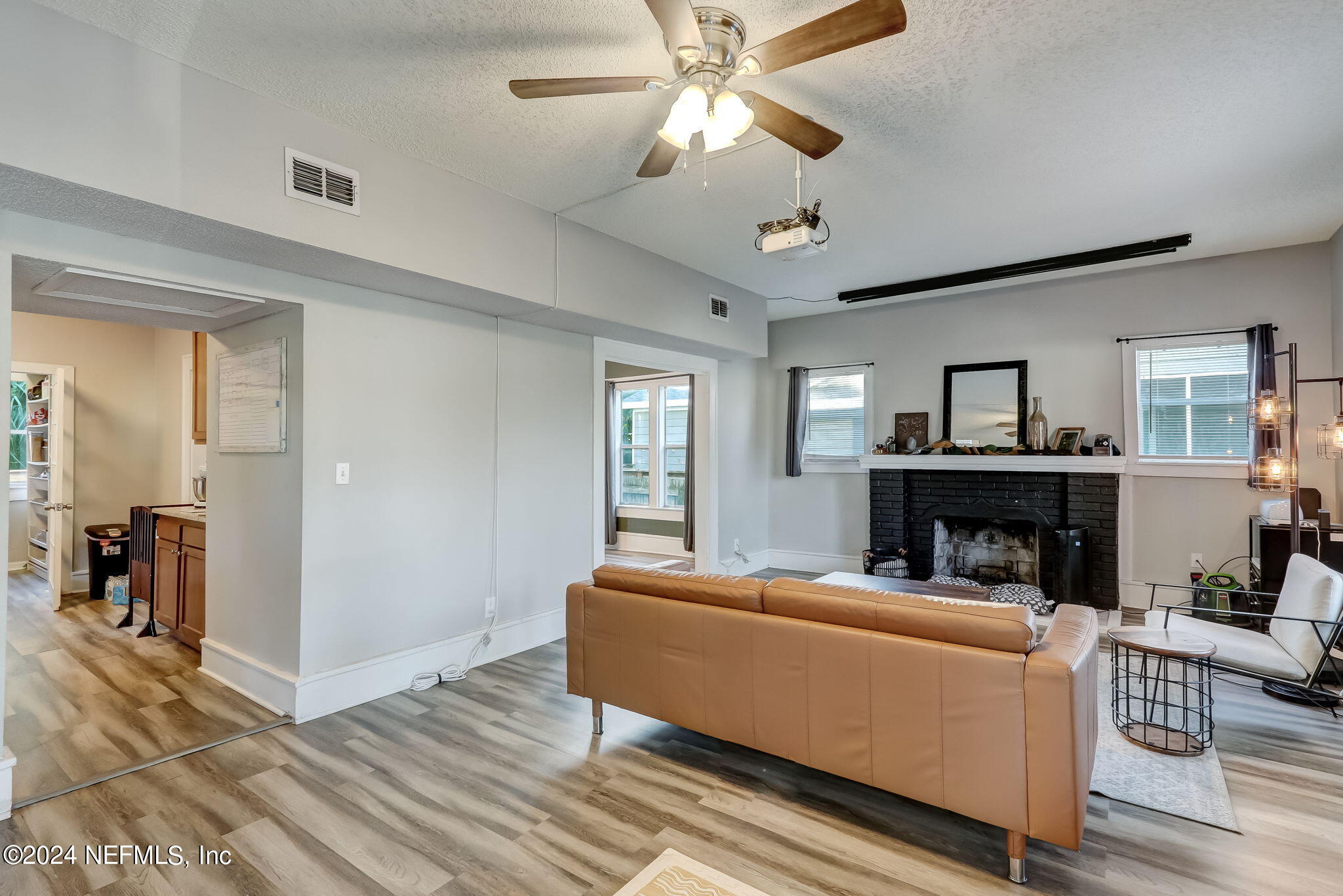 5316 Colonial Avenue Jacksonville, FL 32210 - Photo 10 of 30 a living room with furniture and a chandelier