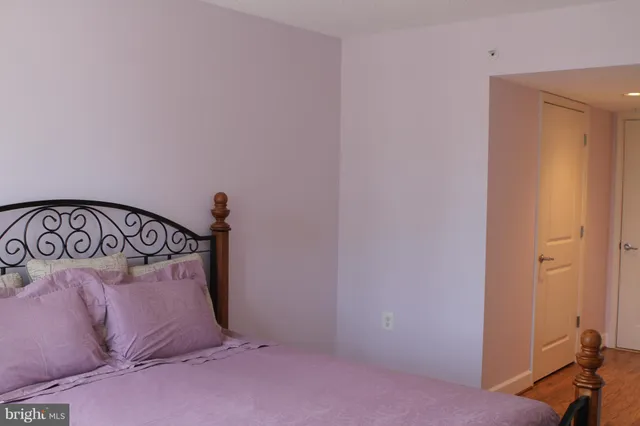 a view of a bedroom with a bed