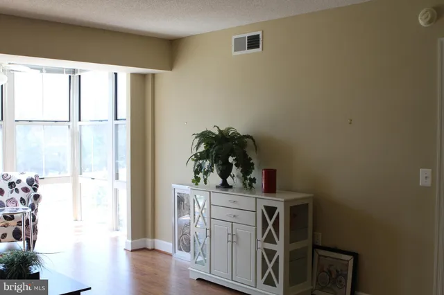 a kitchen with stainless steel appliances a refrigerator and a stove