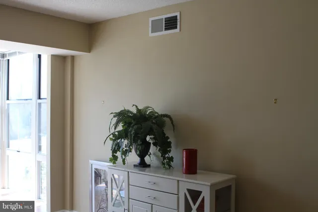 a room with a refrigerator and cabinets