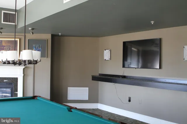 a kitchen with a refrigerator and a stove