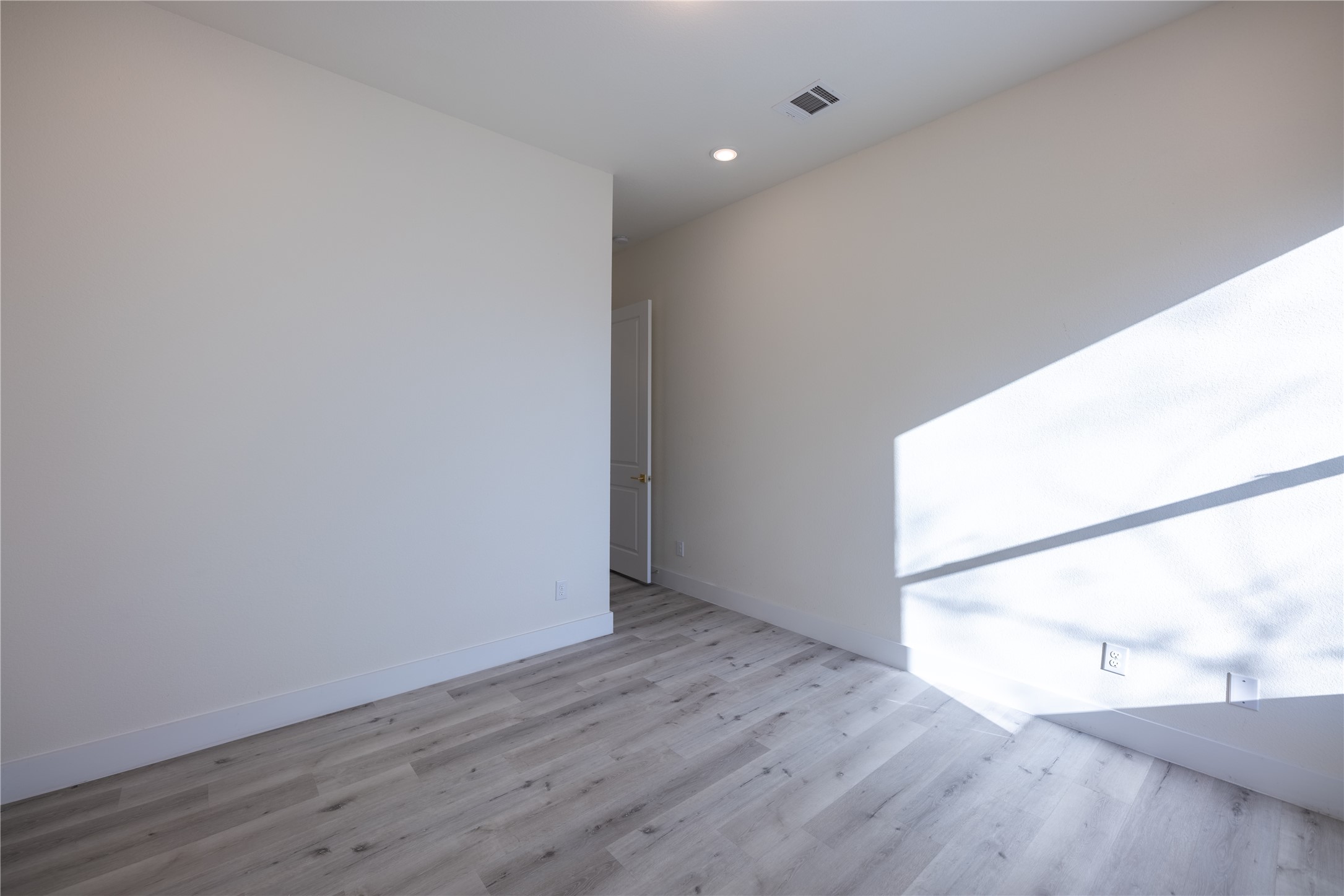 5906 St Augustine Street, Unit B Houston, TX 77021 - Photo 21 of 27 an empty room with wooden floor