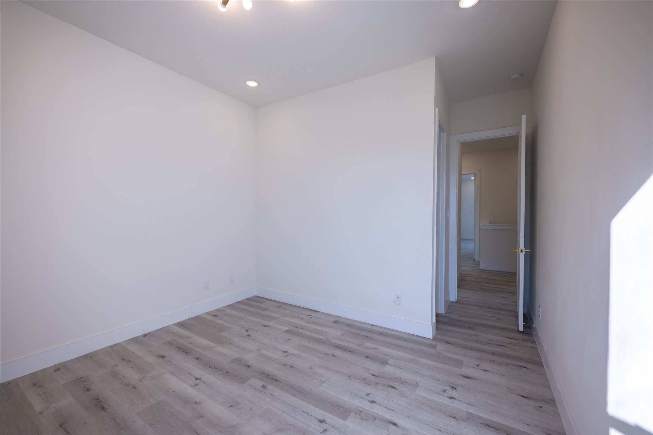 5906 St Augustine Street, Unit B Houston, TX 77021 - Photo 22 of 27 a view of a small space with wooden floor and a window