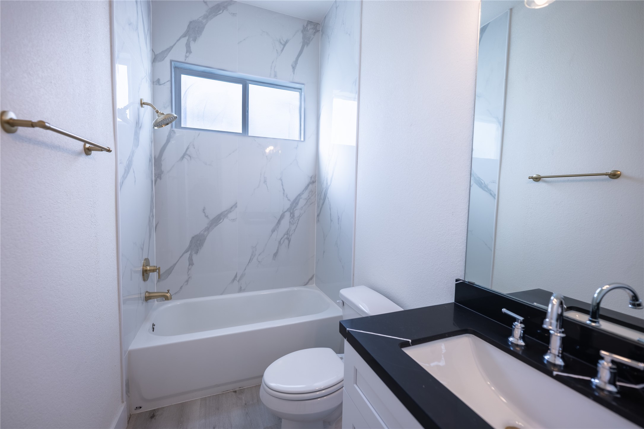 5906 St Augustine Street, Unit B Houston, TX 77021 - Photo 26 of 27 a bathroom with a sink a toilet and a bathtub