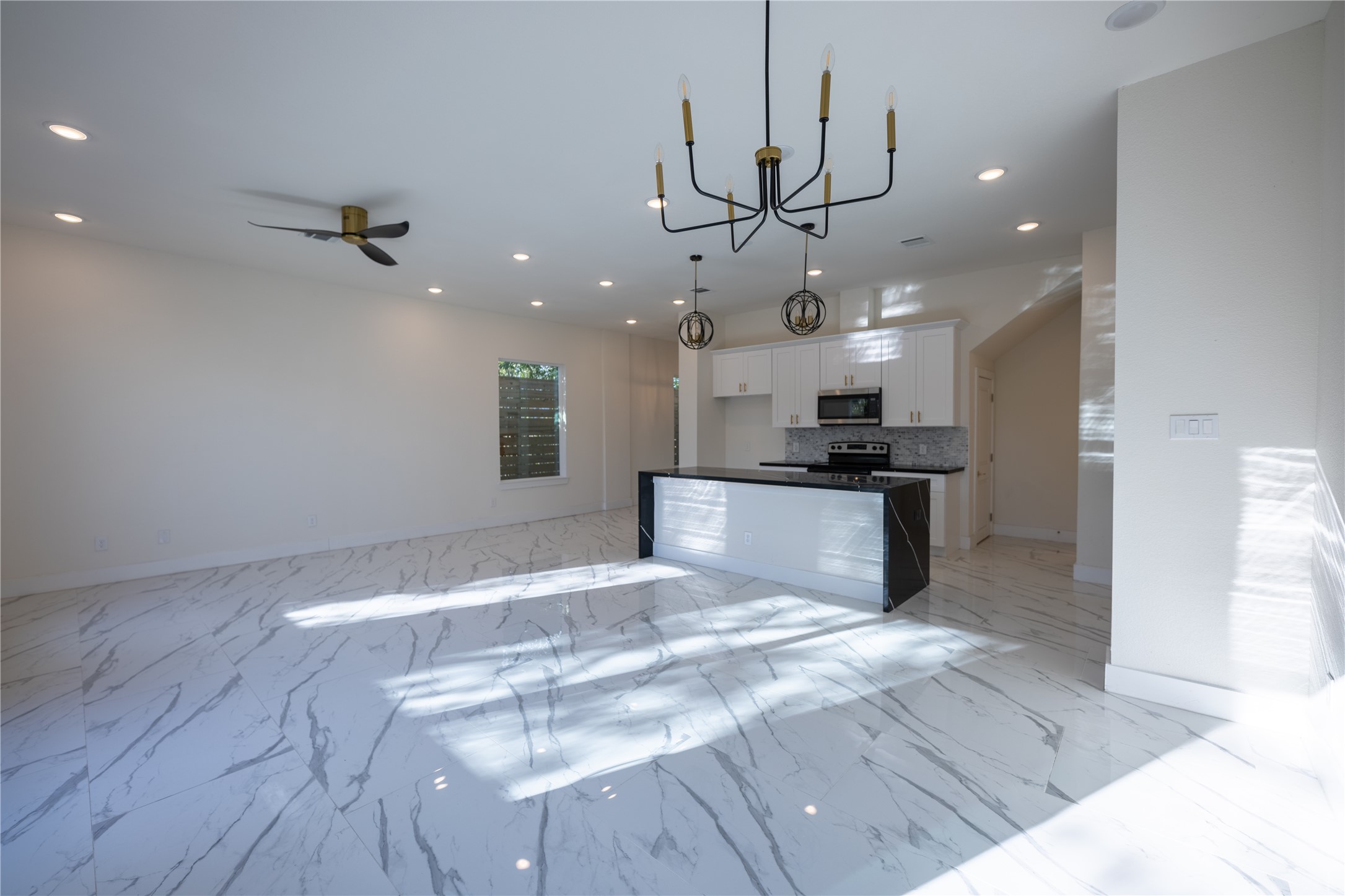 5906 St Augustine Street, Unit B Houston, TX 77021 - Photo 4 of 27 a view of a kitchen with a sink stainless steel appliances and cabinets