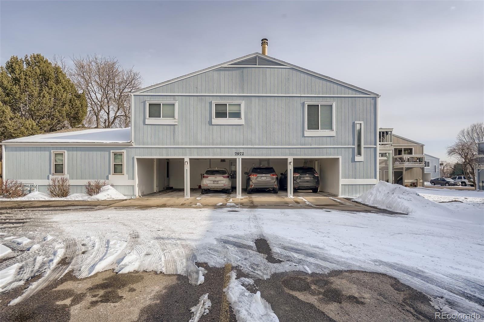 7972 Chase Circle, Unit 82 Arvada, CO 80003 - Photo 11 of 11 a front view of a house with a bed