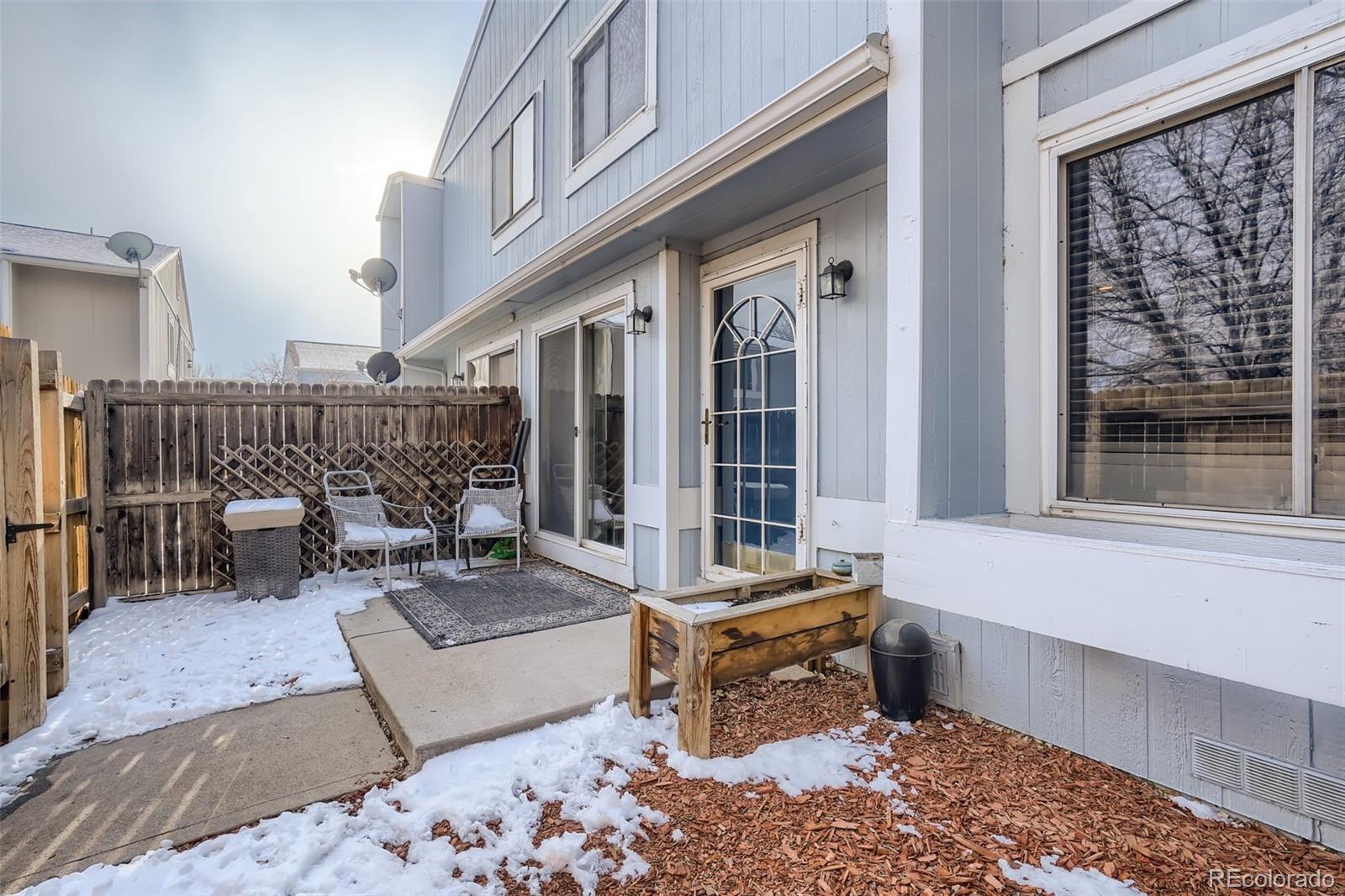 7972 Chase Circle, Unit 82 Arvada, CO 80003 - Photo 10 of 11 a living room with furniture and a window
