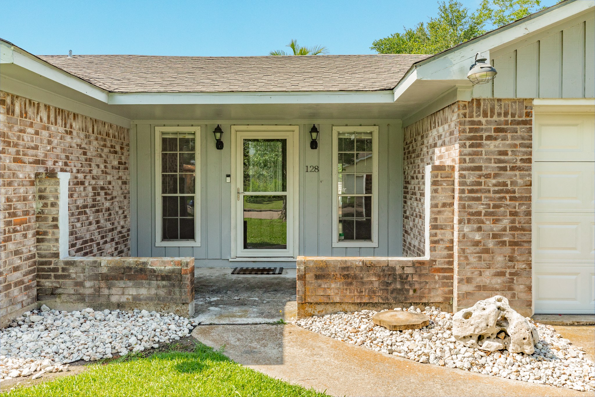 128 Houston Street Angleton, TX 77515 - Photo 6 of 25 a front view of a house with a yard