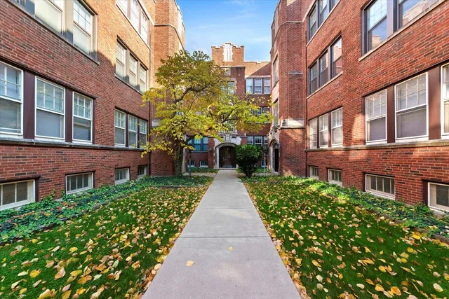 a view of a building with a yard