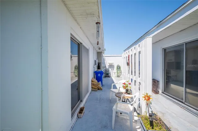 a backyard of a house with outdoor seating