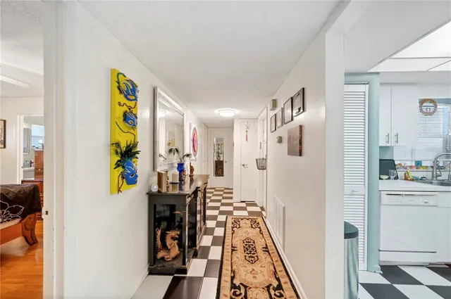 a view of a hallway with dining area