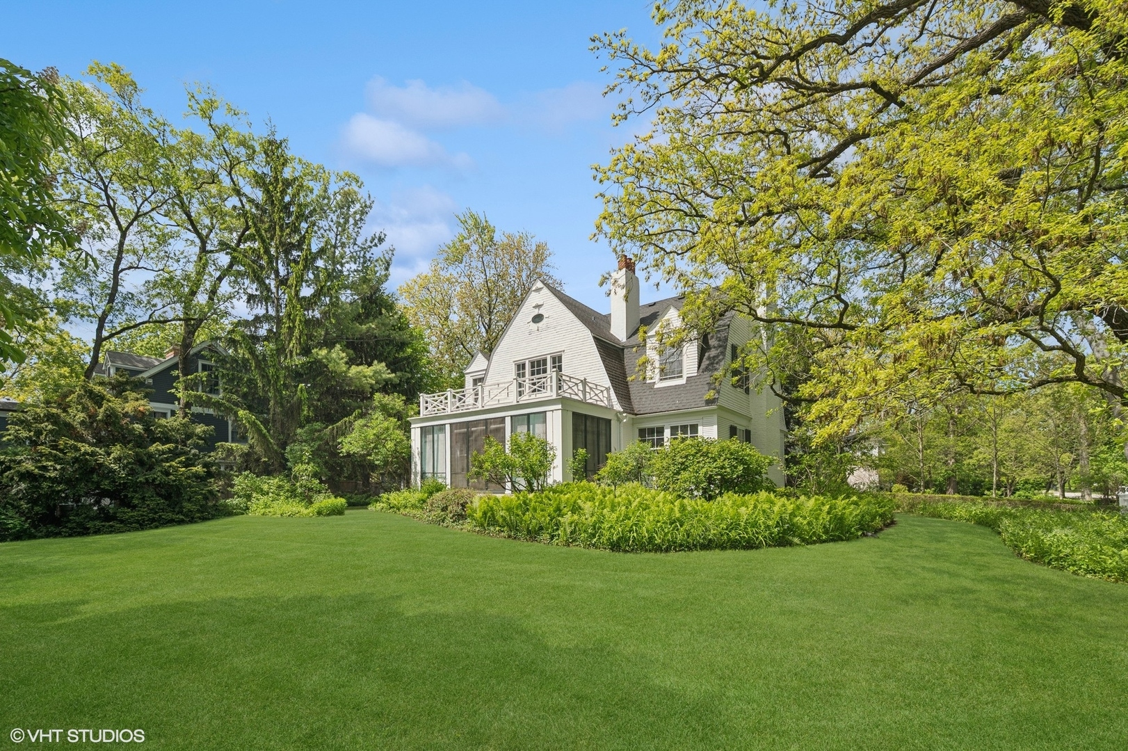 550 Oak Street Winnetka, IL 60093 - Photo 1 of 45 a house with a tree in front of it