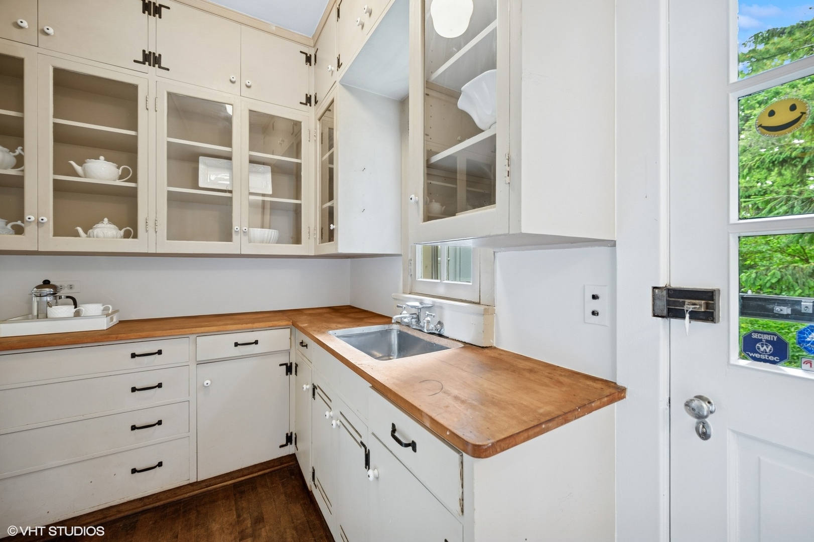 550 Oak Street Winnetka, IL 60093 - Photo 25 of 45 a kitchen with a sink and cabinets