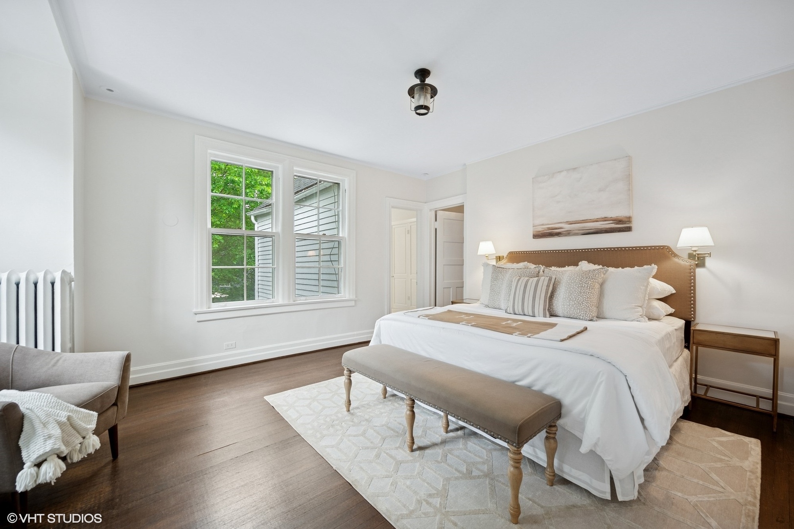 550 Oak Street Winnetka, IL 60093 - Photo 28 of 45 a bedroom with a bed and wooden floor