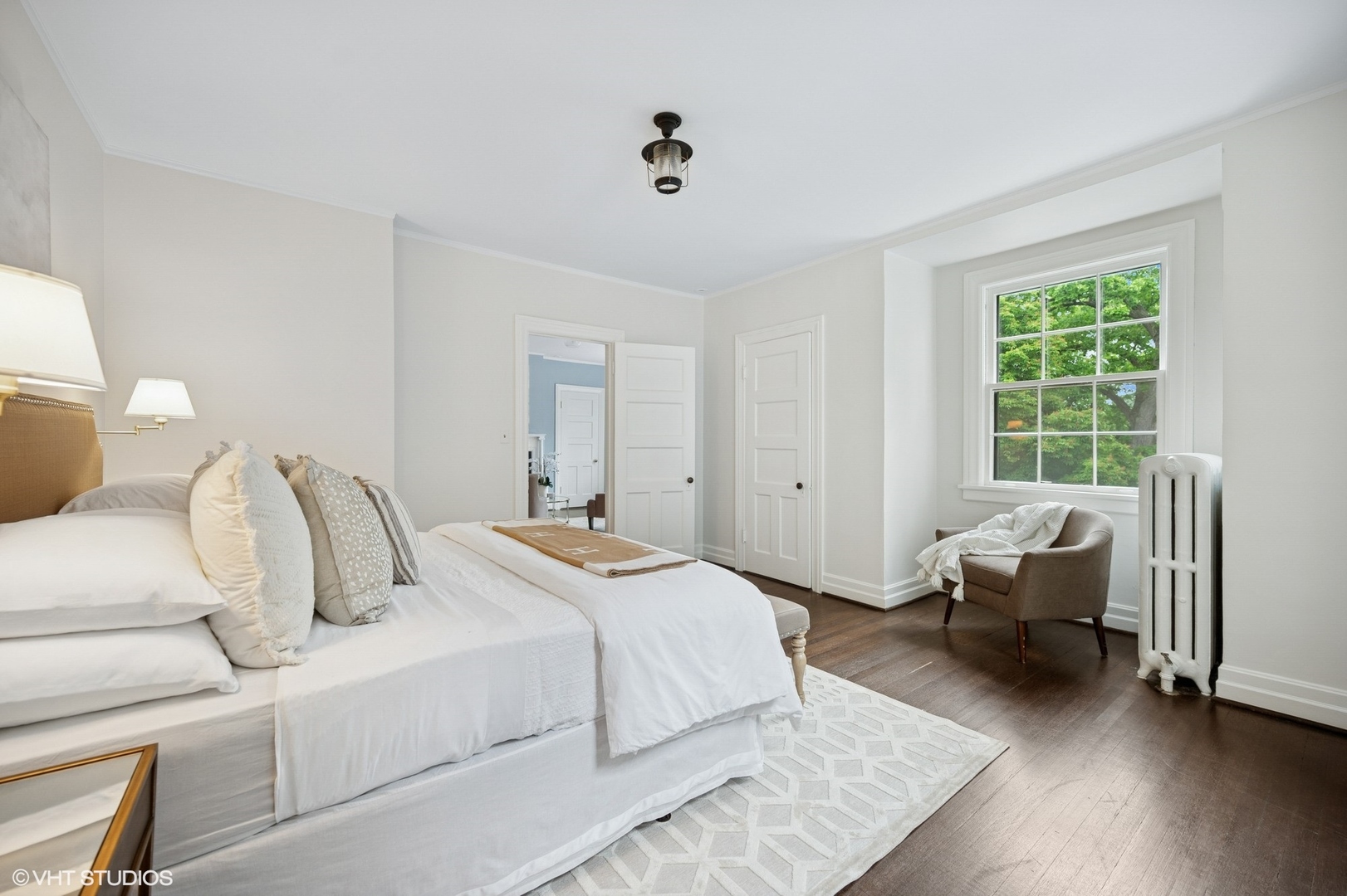550 Oak Street Winnetka, IL 60093 - Photo 29 of 45 a bedroom with a bed and wooden floor