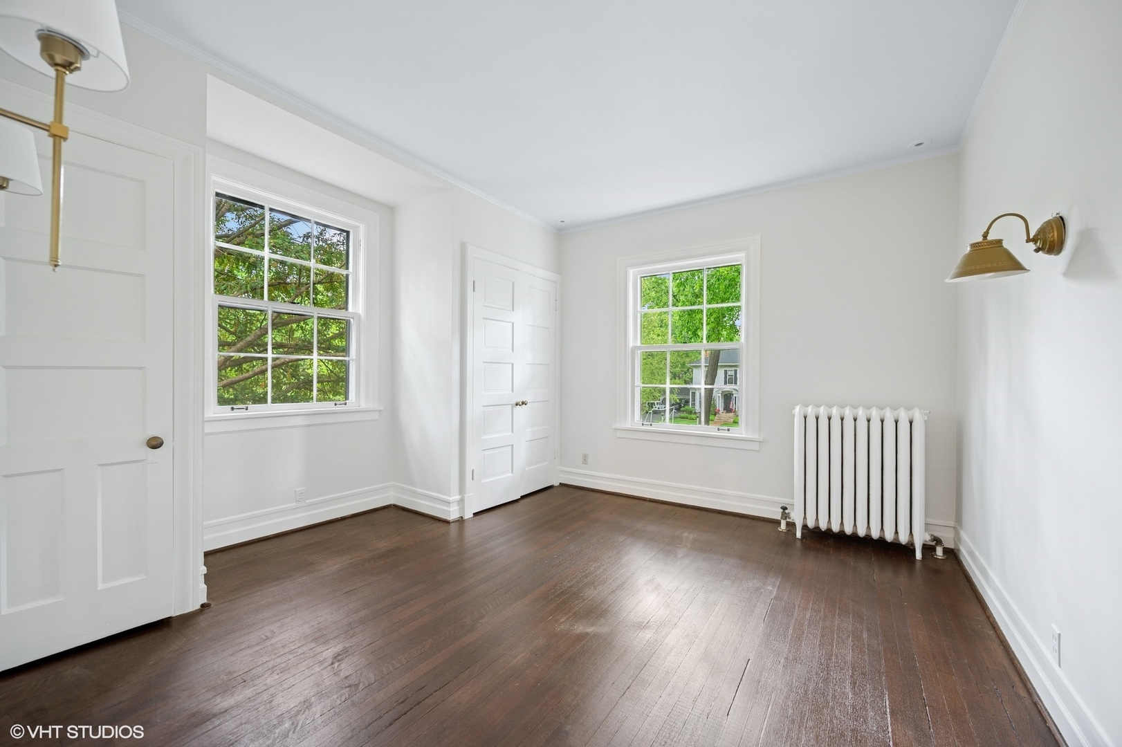 550 Oak Street Winnetka, IL 60093 - Photo 35 of 45 a view of an empty room with wooden floor and a window
