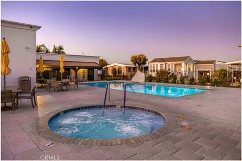 a view of a patio with swimming pool