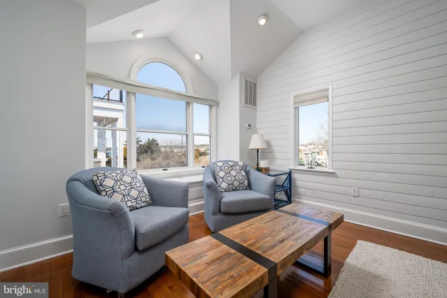 a large kitchen with a table and chairs