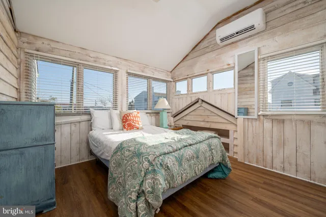 a bedroom with a bed and a table in it