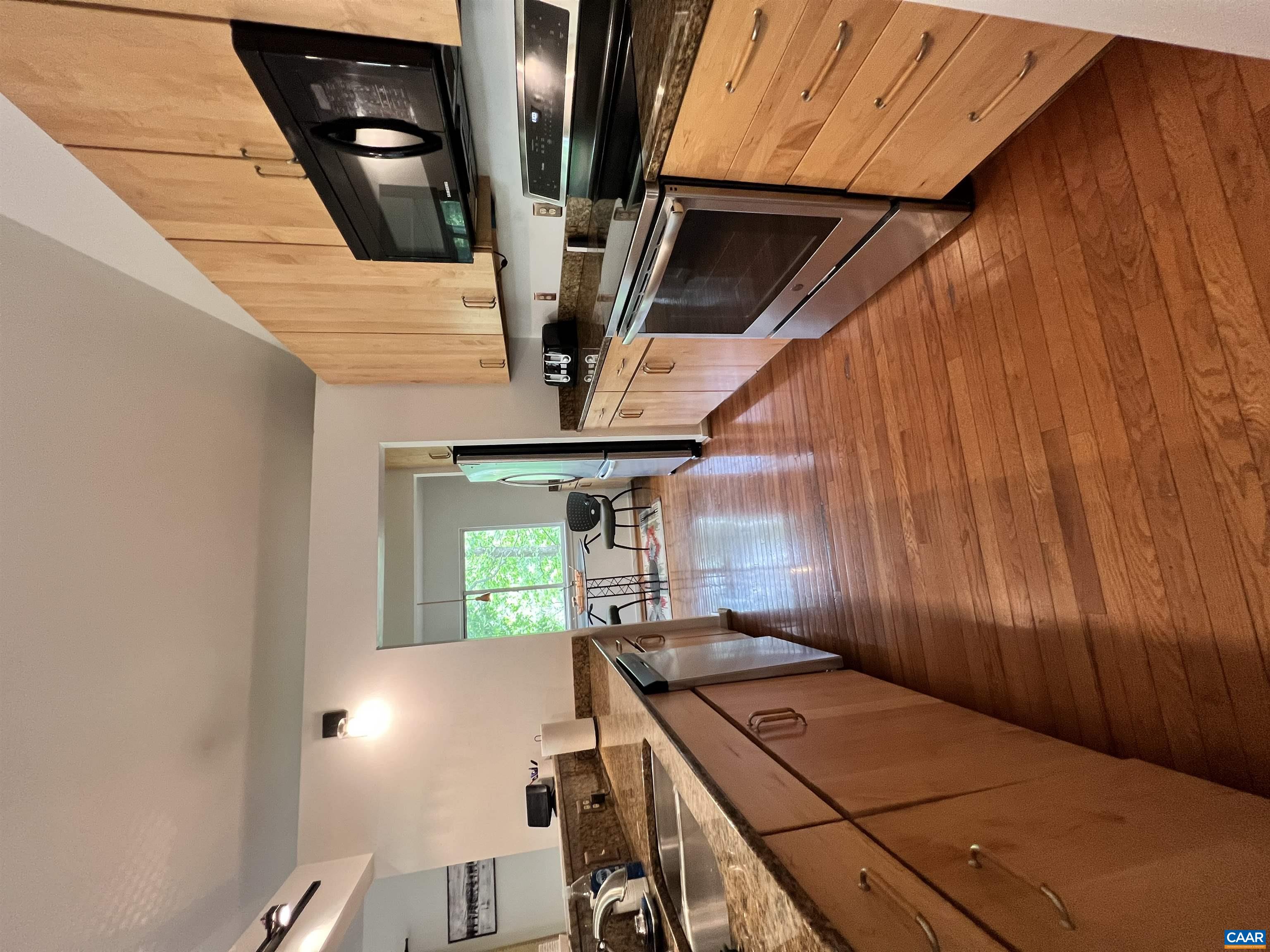 1663 Brandywine Drive Charlottesville, VA 22901 - Photo 3 of 16 a kitchen with stainless steel appliances a stove sink and microwave