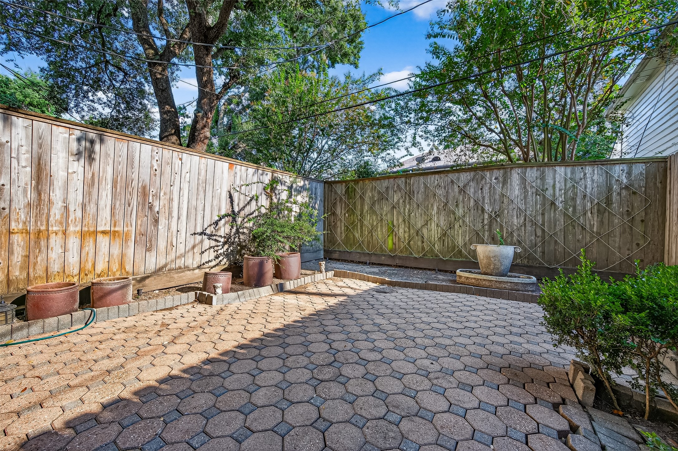3027 Bissonnet Street Houston, TX 77005 - Photo 45 of 47
Fully enclosed backyard with privacy fencing and shade trees — a quiet spot that's completely yours