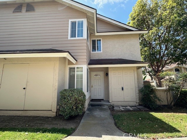 a view of backyard of house and trees