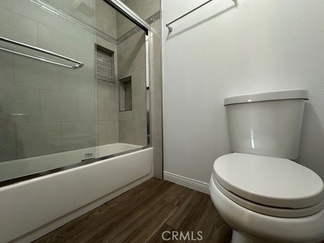 12621 Moordale Circle, Unit H Stanton, CA 90680 - Photo 13 of 17 a bathroom with a toilet and a bathtub