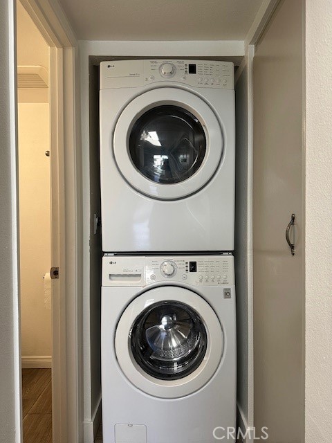 12621 Moordale Circle, Unit H Stanton, CA 90680 - Photo 15 of 17 a utility room with dryer and washer
