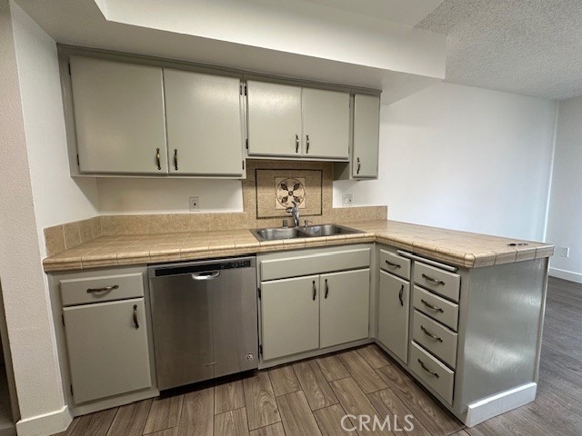 12621 Moordale Circle, Unit H Stanton, CA 90680 - Photo 3 of 17 a kitchen with a sink cabinets and appliances