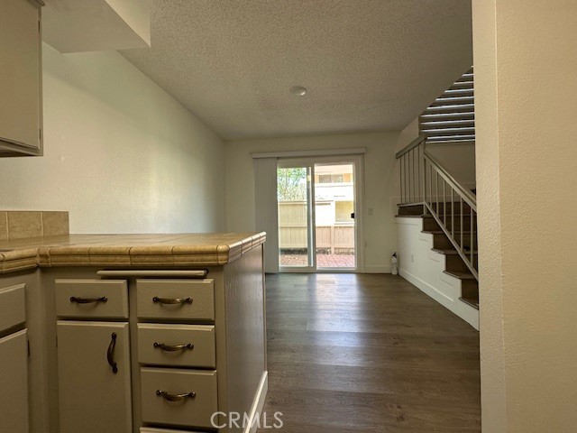 12621 Moordale Circle, Unit H Stanton, CA 90680 - Photo 10 of 17 a kitchen with wooden floor and a sink