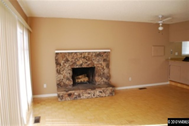 1950 Stardust Street Reno, NV 89503 - Photo 4 of 6 a living room with a fireplace