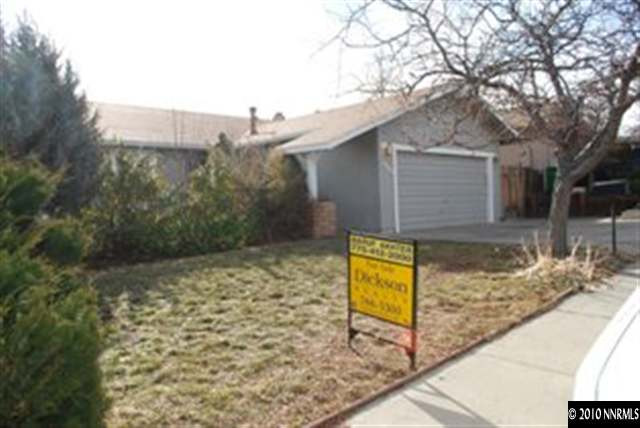 1950 Stardust Street Reno, NV 89503 - Photo 6 of 6 a view of house with trees