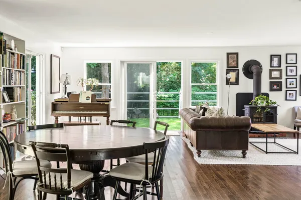 a dining room with furniture and window