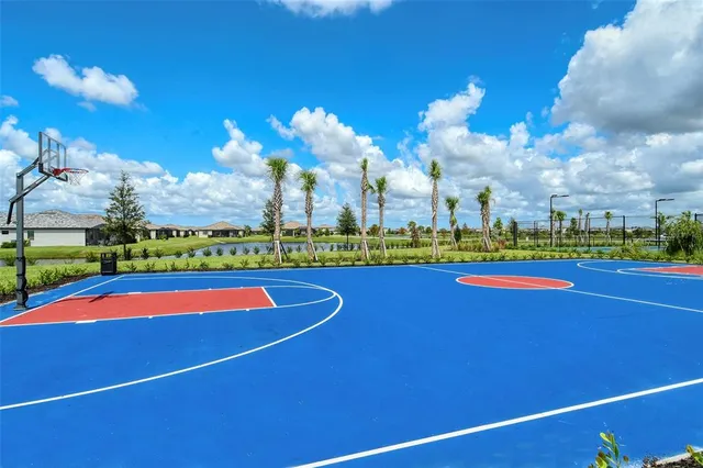 a view of a playground with basketball court