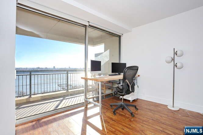 4 Horizon Road, Unit 1027 Fort Lee, NJ 07024 - Photo 11 of 38 a view of a workspace with furniture and a window