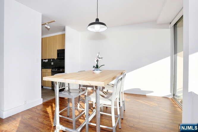 4 Horizon Road, Unit 1027 Fort Lee, NJ 07024 - Photo 15 of 38 a very nice looking dining room with a table and chairs