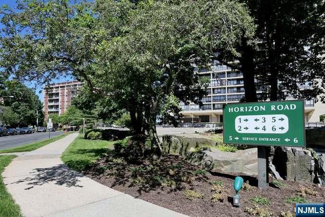 4 Horizon Road, Unit 1027 Fort Lee, NJ 07024 - Photo 28 of 38 a sign on the side of the road