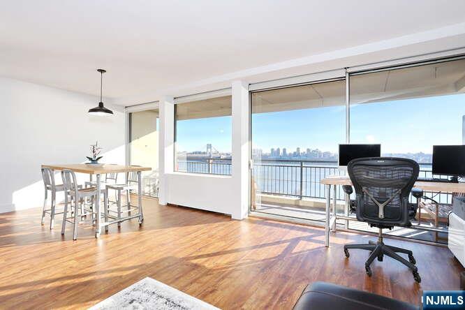 4 Horizon Road, Unit 1027 Fort Lee, NJ 07024 - Photo 9 of 38 a work room with furniture and wooden floor