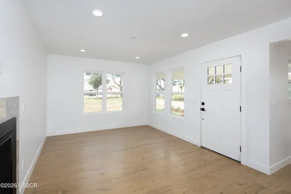 a view of an empty room and a window