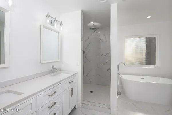 a bathroom with a toilet a sink and a mirror