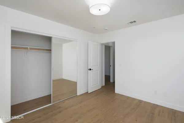 a view of entryway with wooden floor