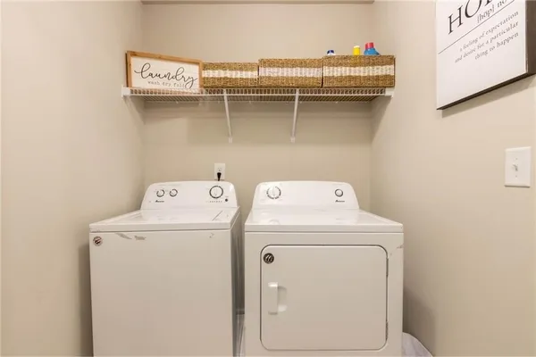 a utility room with dryer and washer