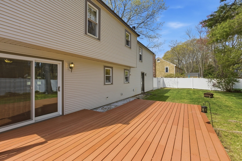 19 Mockingbird Lane Maynard, MA 01754 - Photo 29 of 34 a view of backyard with a garden